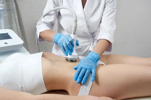 Lost the Weight but Not the Loose Skin? 2 woman having HIFU treatment on her stomach to combat loose skin Luton following weight loss